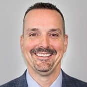 Smiling man in a suit portrait.