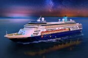 Cruise ship sailing under a starry sky.