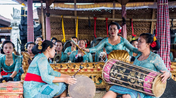 A traditional gamelan orchestra entertains passengers in Bali. Photo by John Michaels/Alamy Stock Photo
